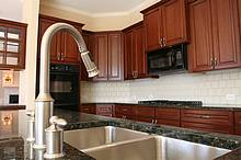 Satin Nickle gooseneck faucet with pullout sprayer.